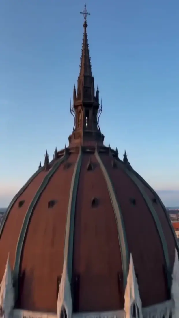 A still from the city reel, a church dome at golden hour