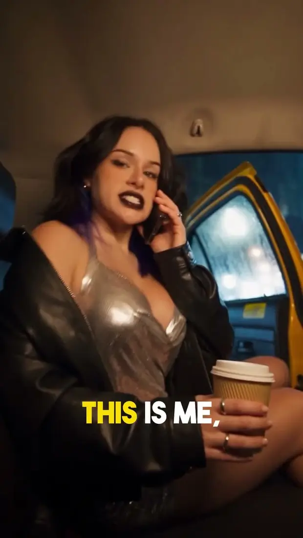 A still from the taxi advert, the character in the back of a cab at night